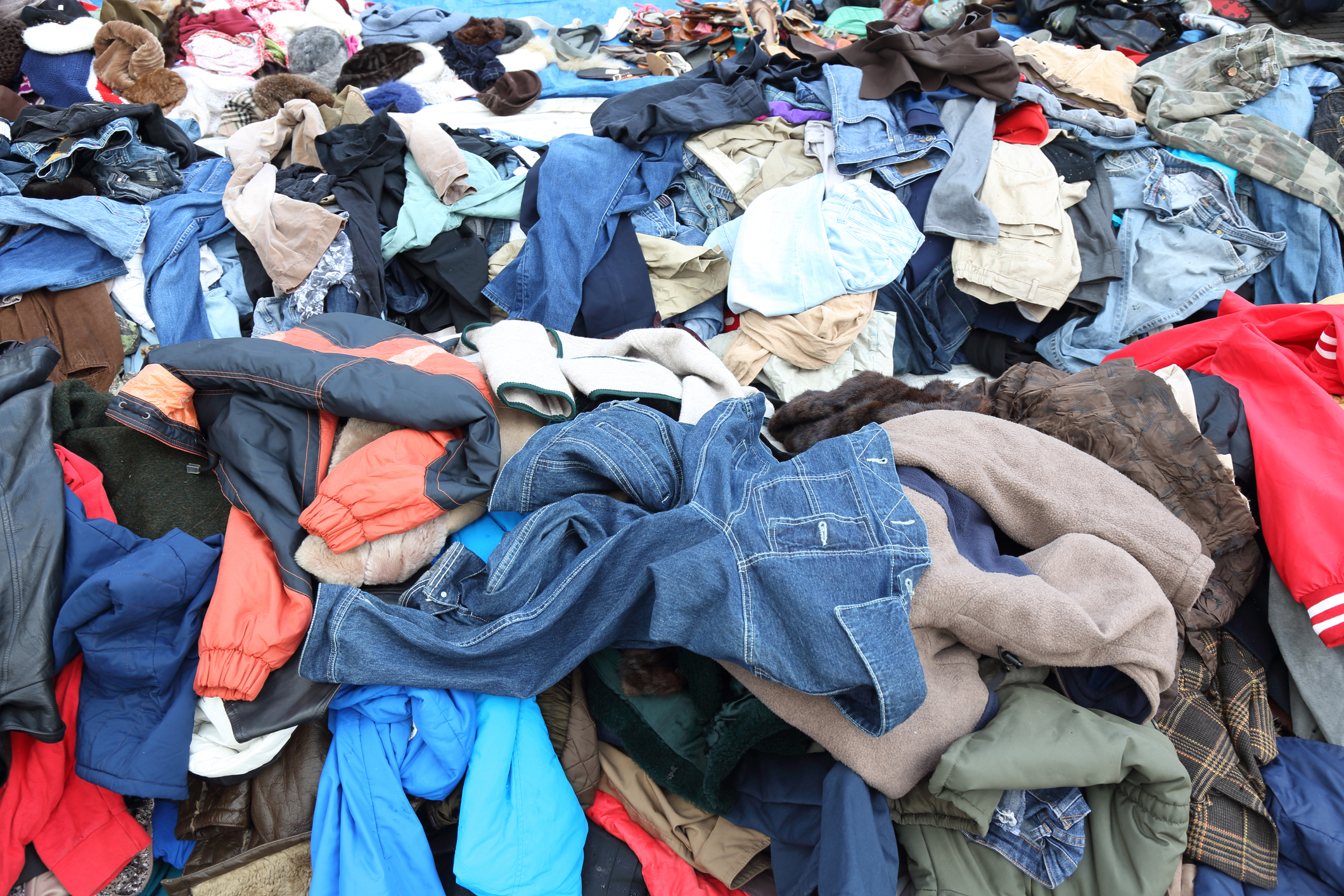 A loose pile of sorted donated clothing